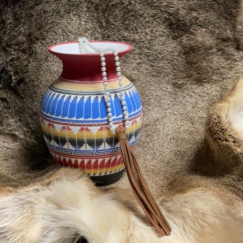 Western imitation pearl necklace with leather tassel. 36 inches long.